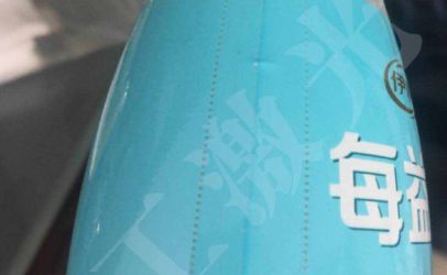 武汉中欧体育激光打标机在果汁饮料热封标签上的多功能应用